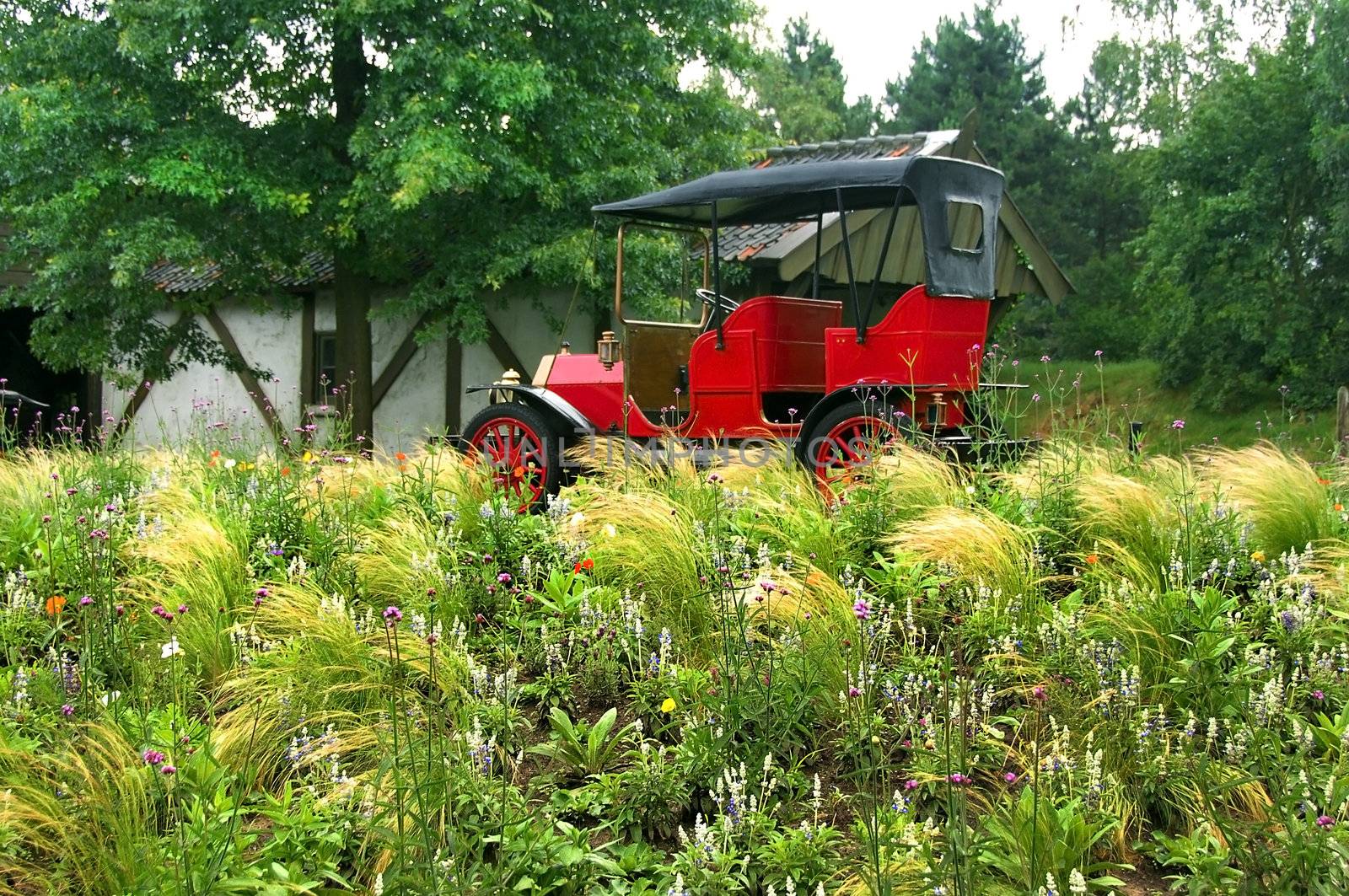 vintage red car standing in holland park