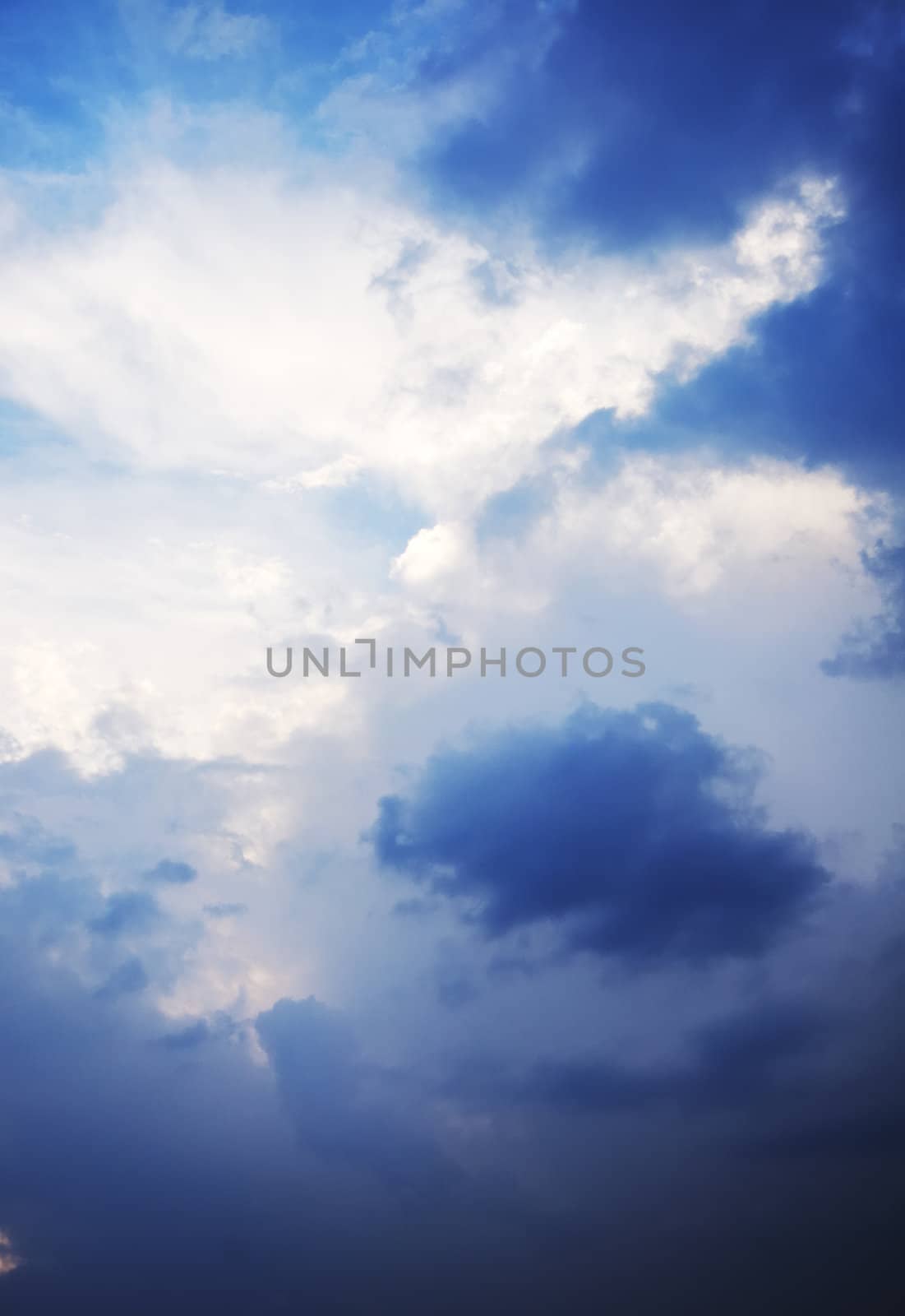 the sky. dark clouds surrounding white area