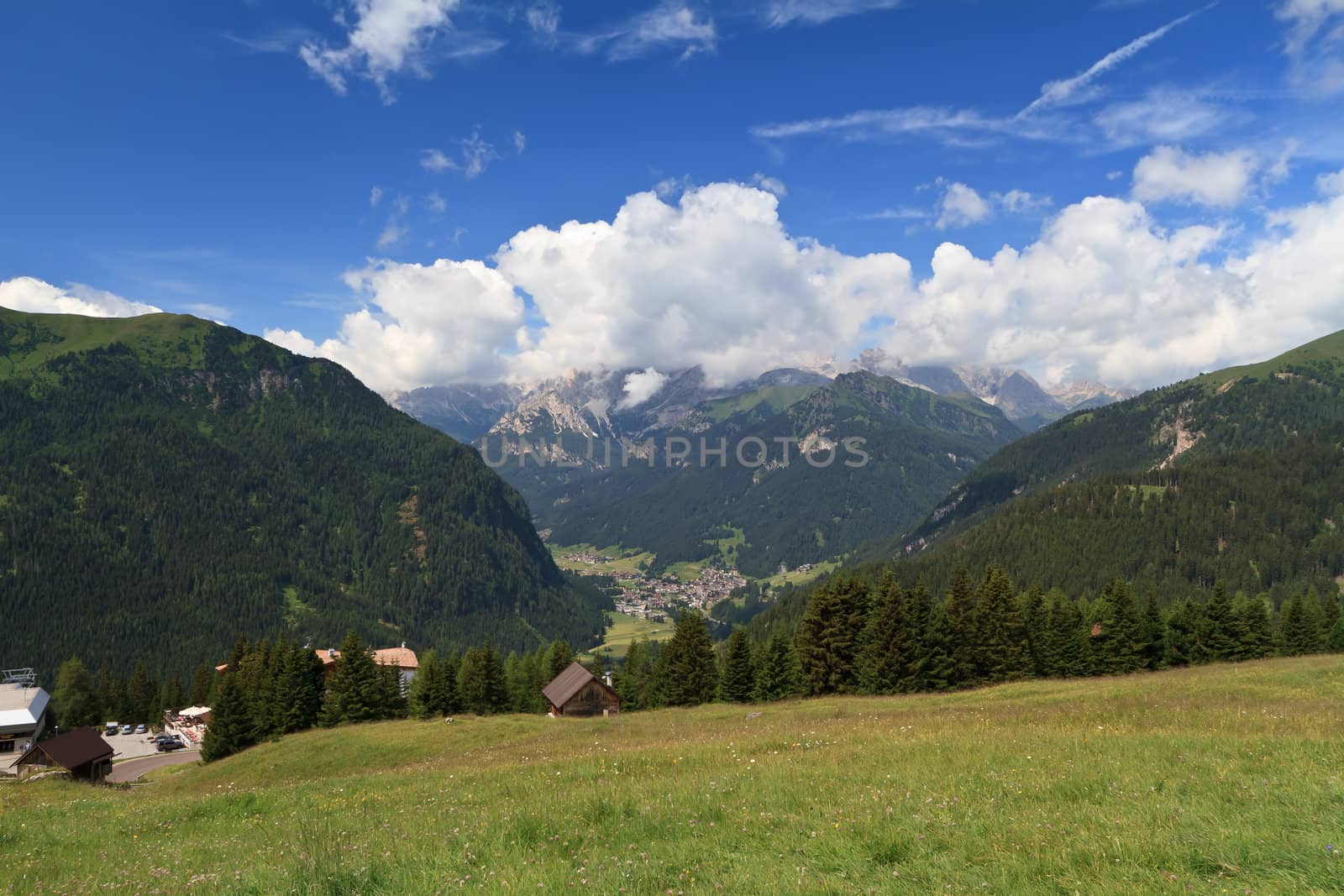 aerial view of Fassa valley with Campitello village on summer. Trentino, Italy