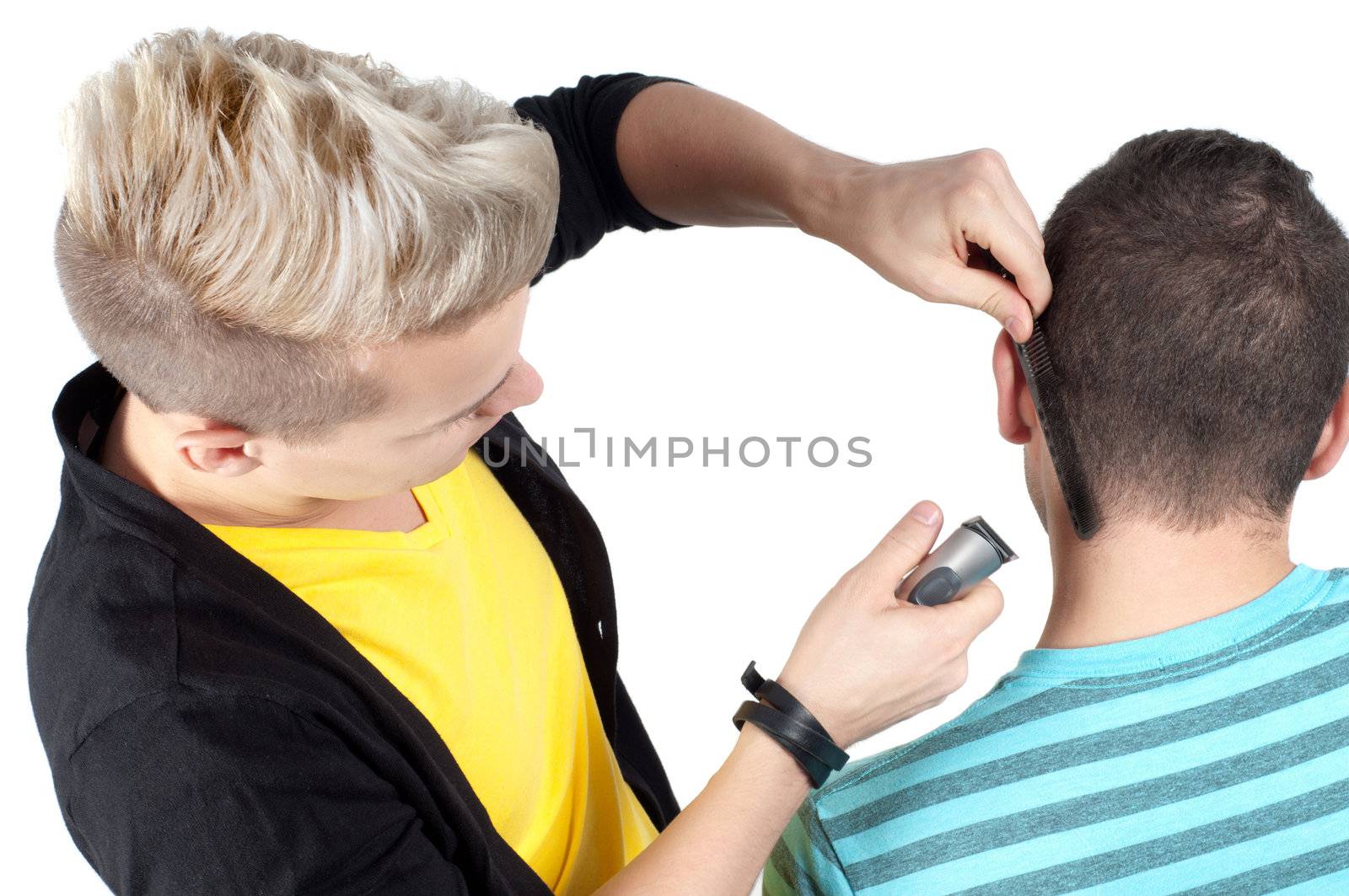 Hairdresser working with razor, studio shooting on white