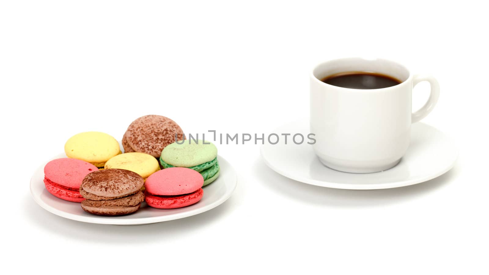 Colorful Macaroon and cup of coffee on white background