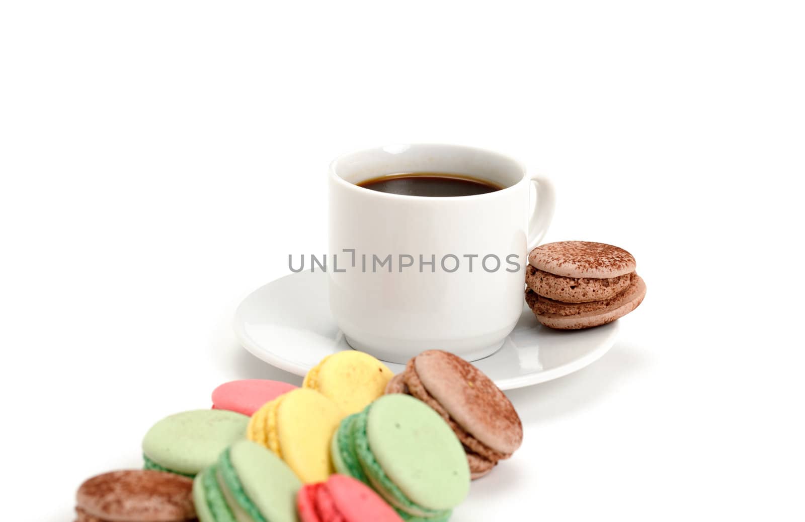 Colorful Macaroon and cup of coffee on white background