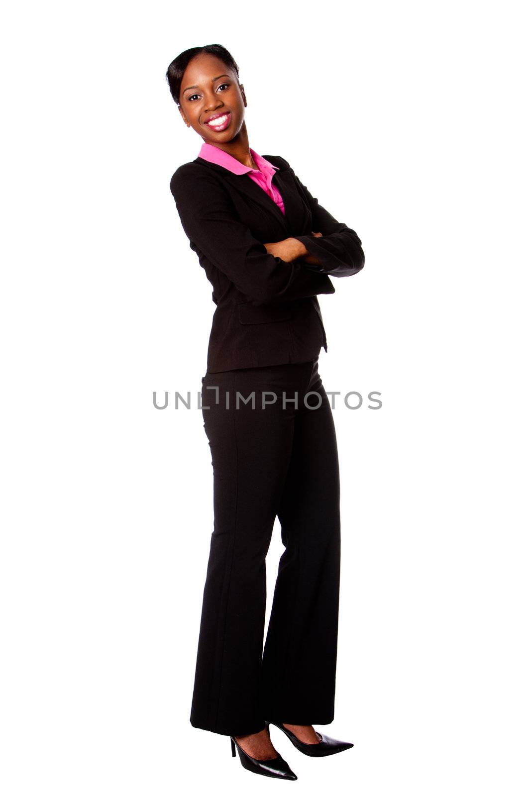 Beautiful happy smiling African corporate business student woman in suit standing with arms crossed, isolated.