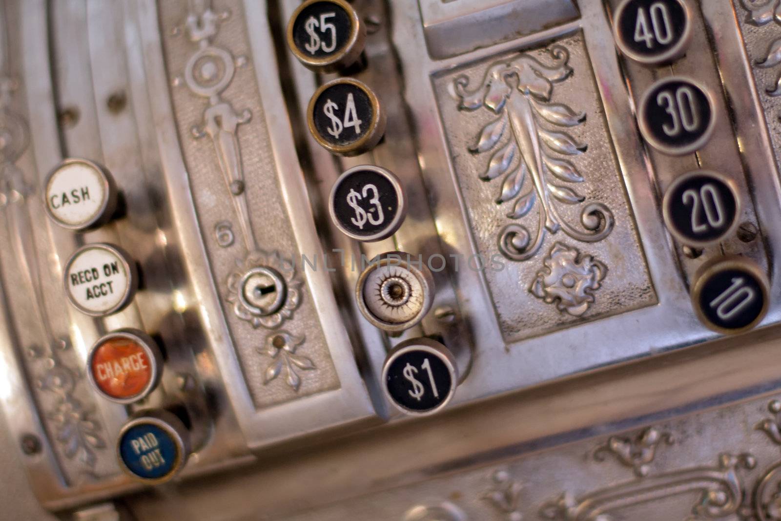 antique store silver cash register buttons close