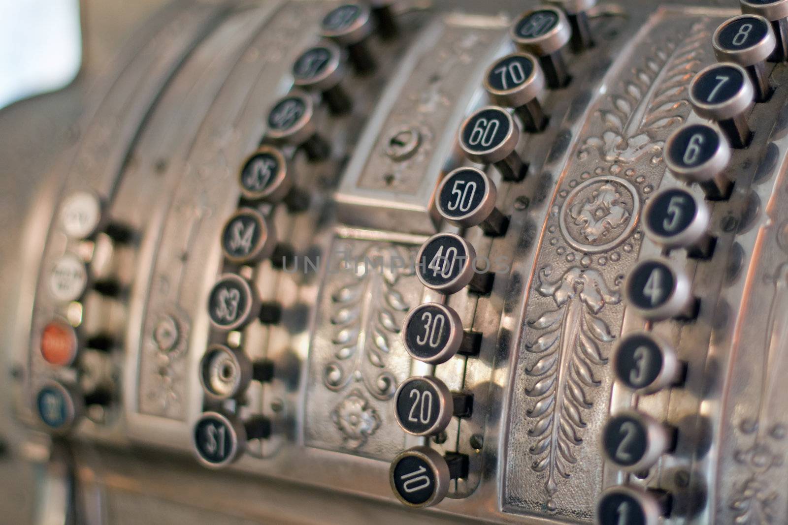 antique store silver cash register buttons close
