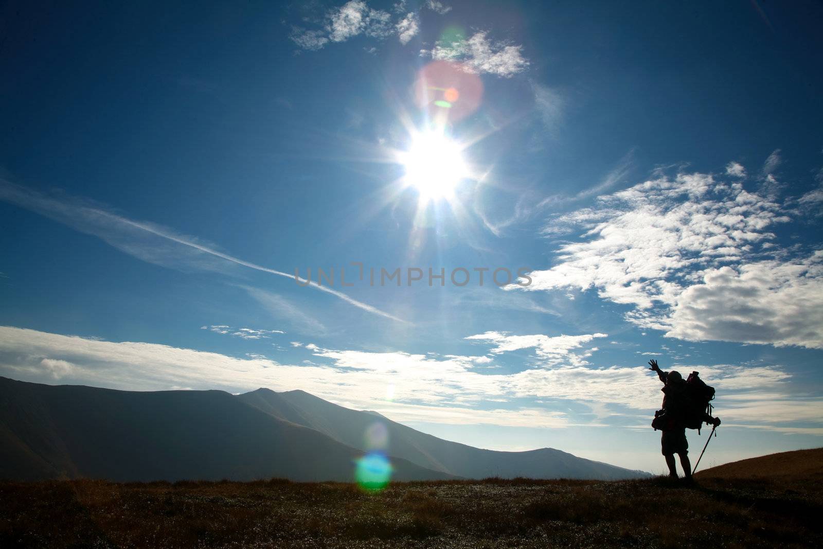 An image of silhouette of man on a hill
