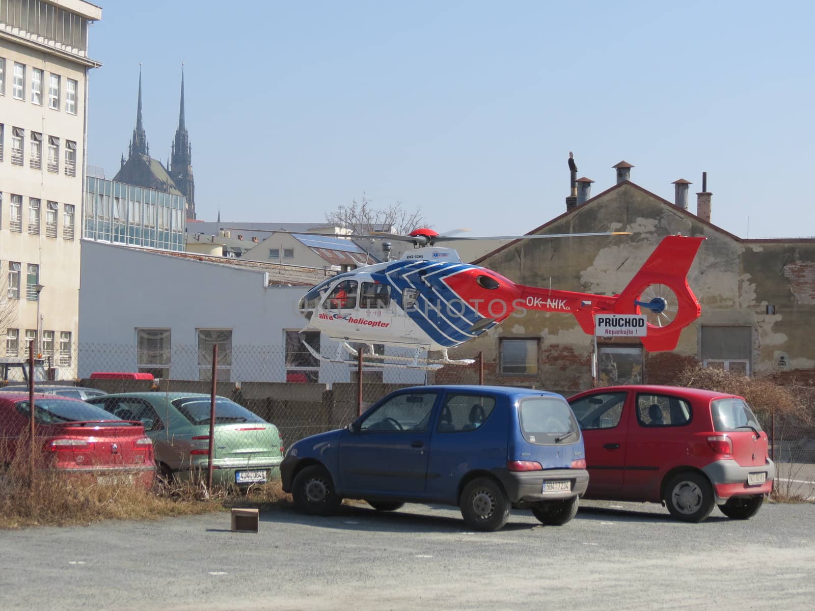 Helicopter flying high in the blue sky