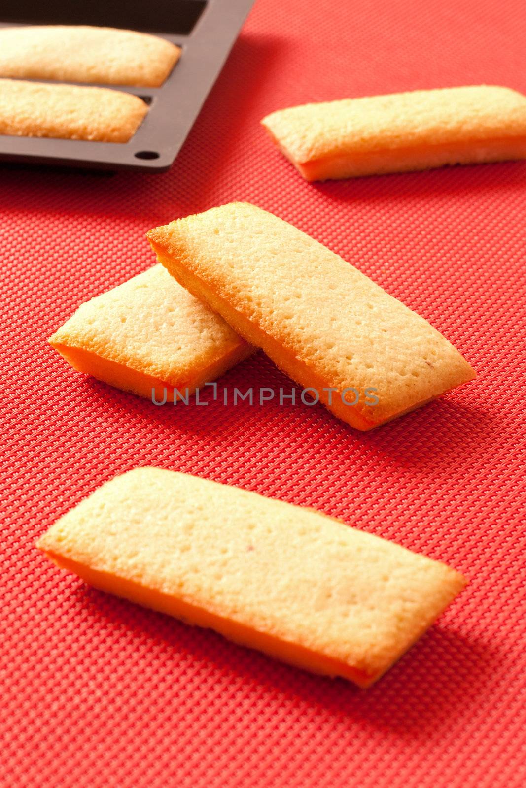 French biscuits called Financiers, with almond powder, smooth inside and crispy on the edges