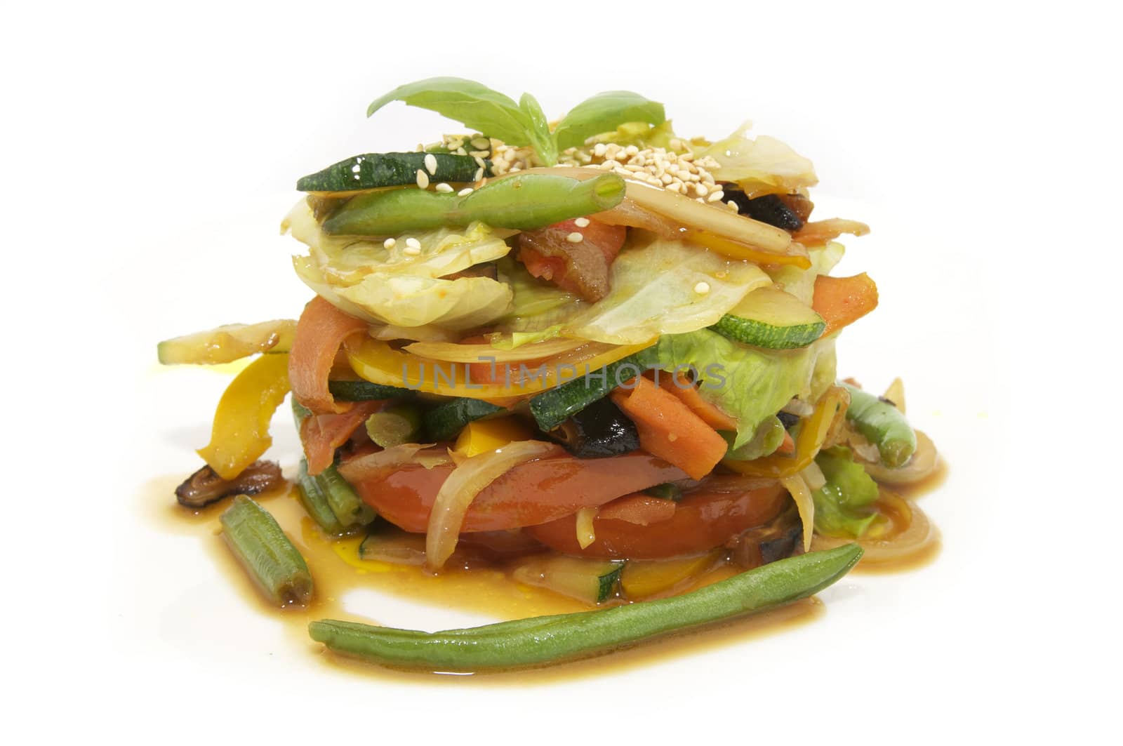 Salad vegetables and greens on a white background