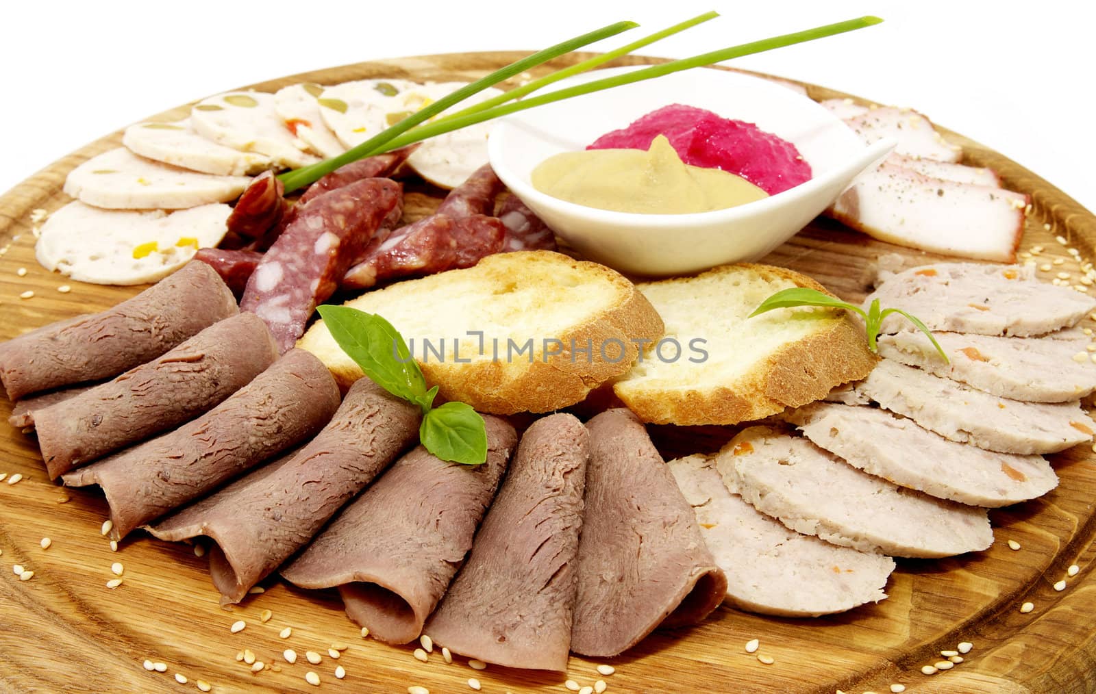 a plate with meat sauce and sausage on a white background