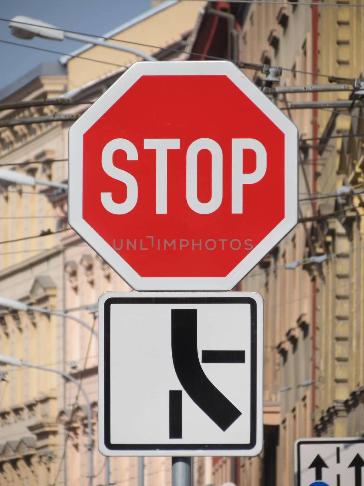Stop - traffic sign at a dangerous crossroad
