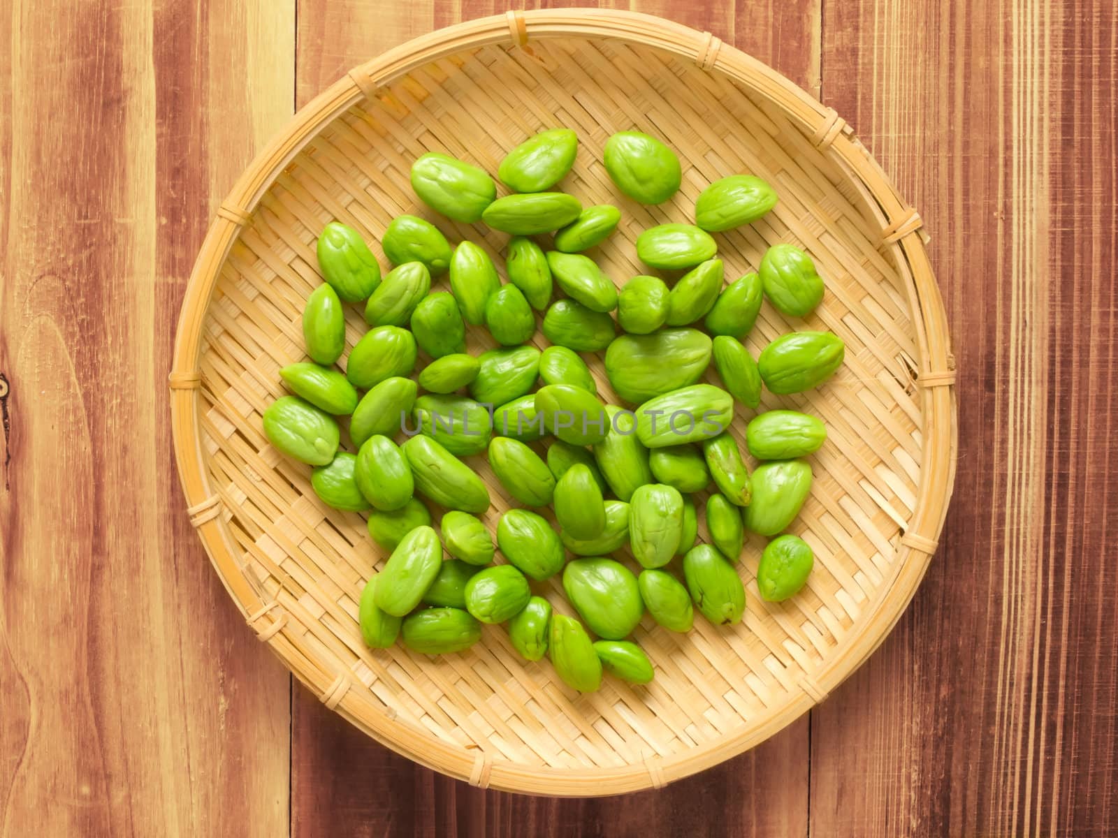 close up of a basket of petai beans