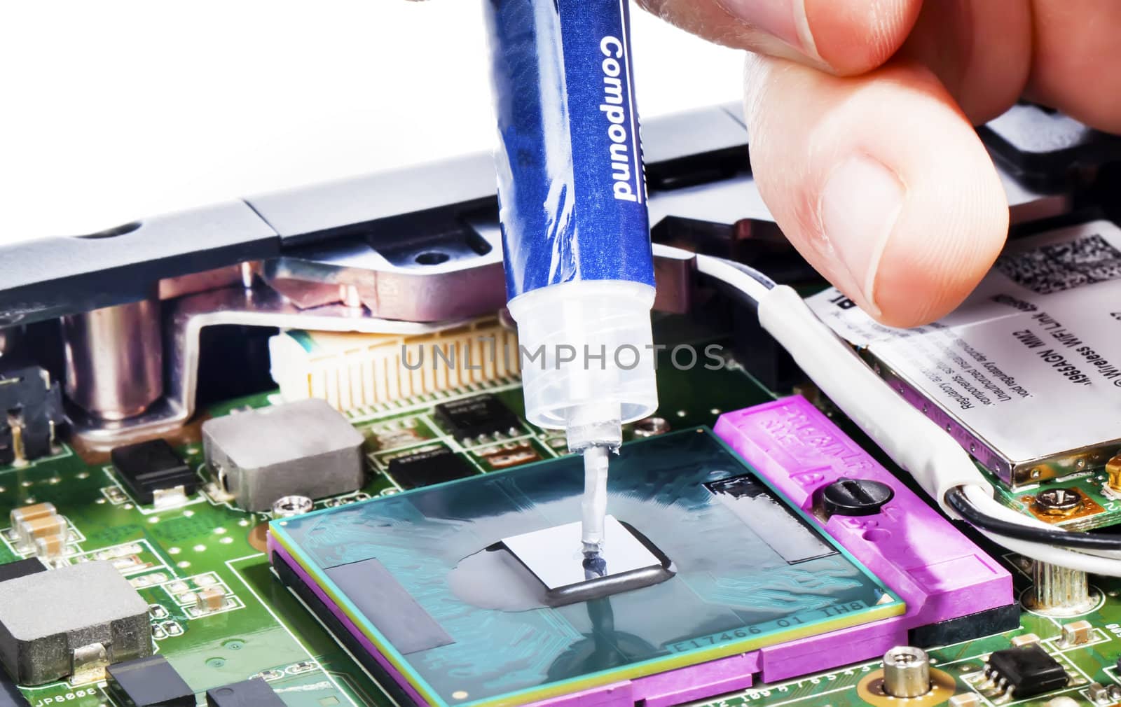 Applying thermal compound on video chip with syringe close view by RawGroup