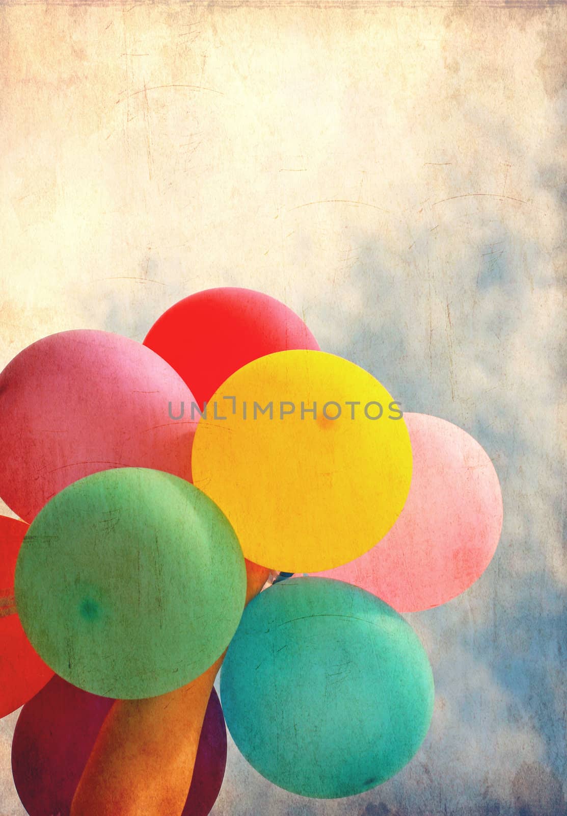 Female holding multicolored balloons with blue sky, photo in old image style