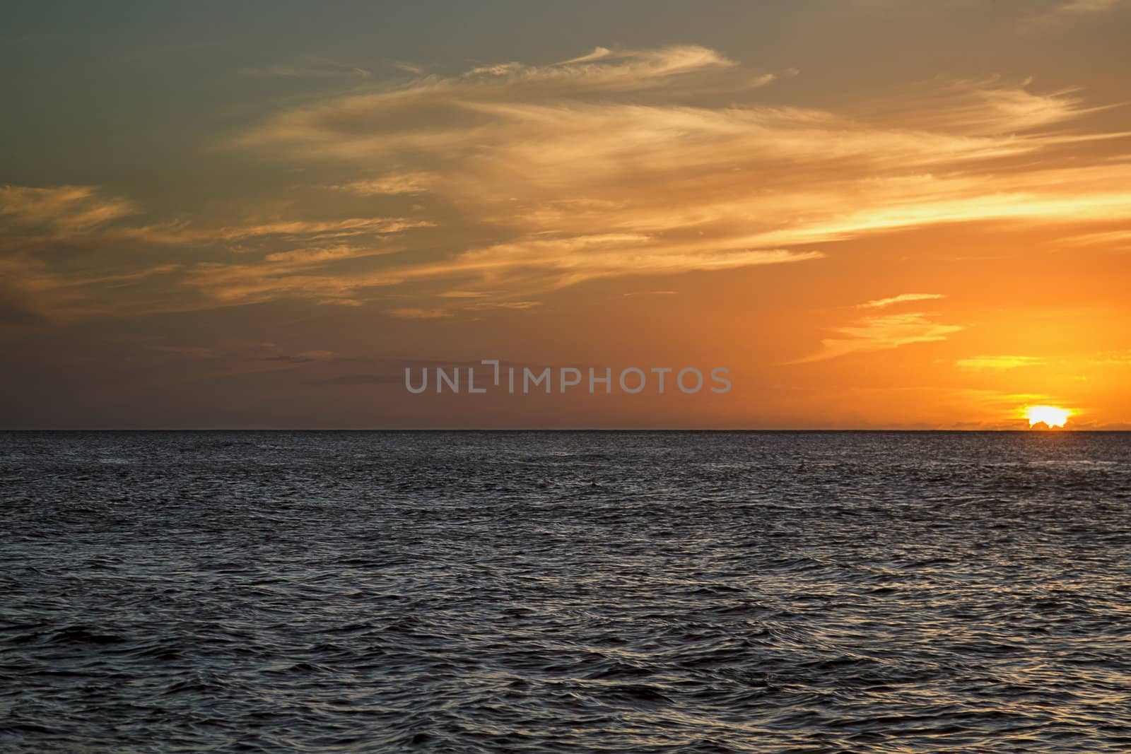 Sunset over a calm pacific ocean