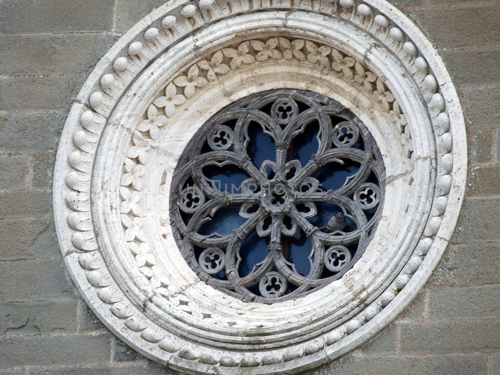 Rose window on the facade of the church of St. Margaret of Cortona