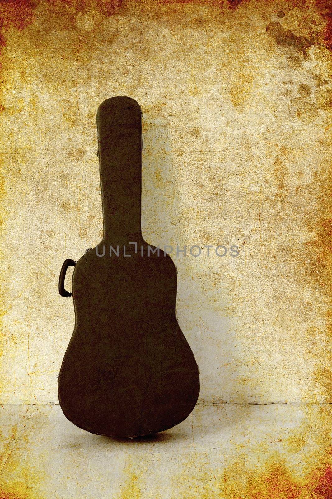 The Old Guitar case on white wall, photo in old image style by nuchylee