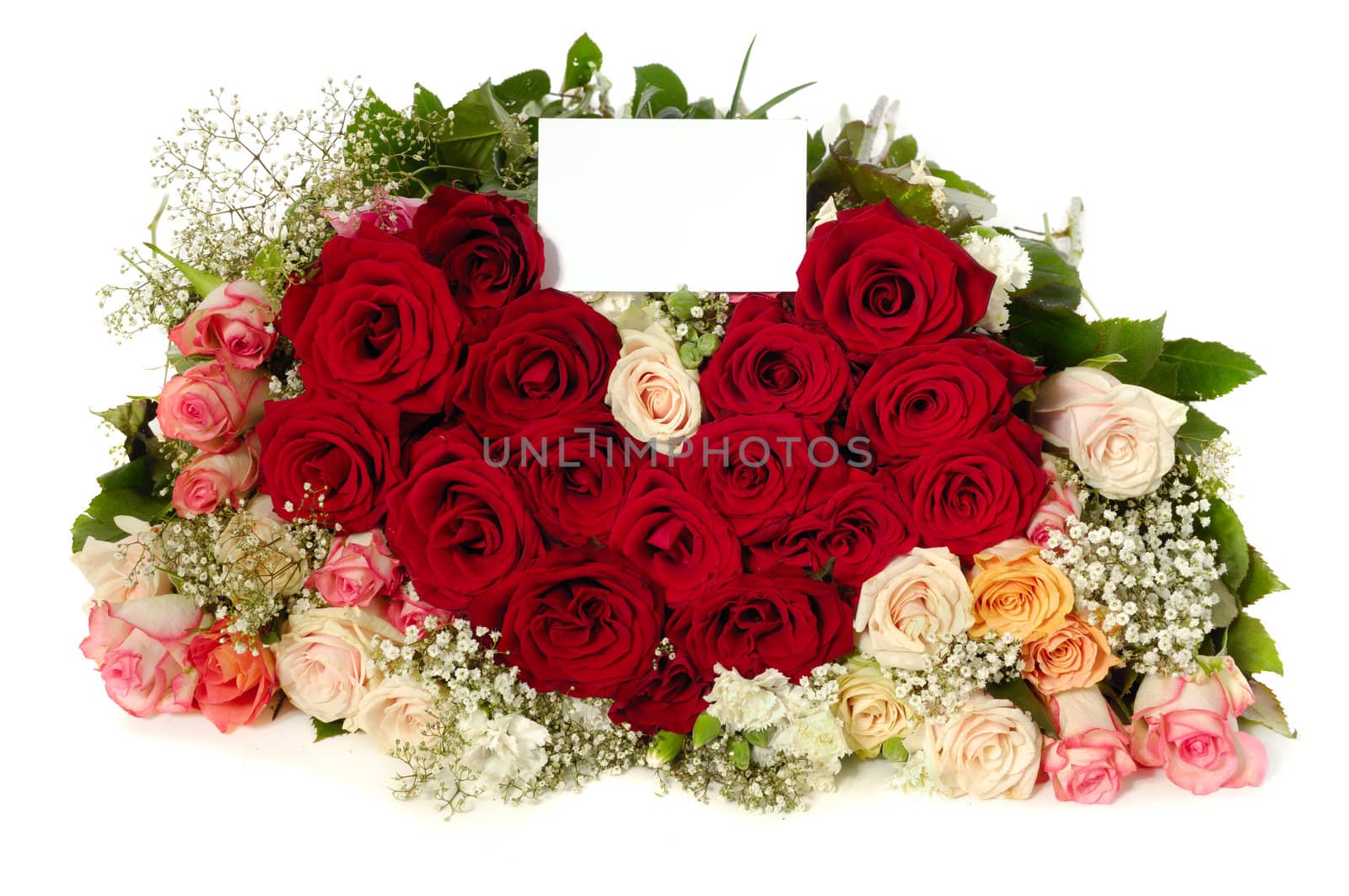 Bouquet of rose flowers with a blank gift card, isolated on white background. The roses are arranged in heart shape.