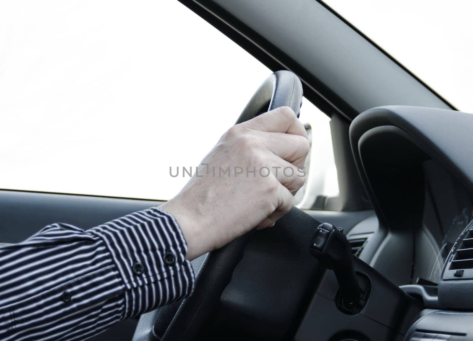 car driver with two hand on the steering wheel 