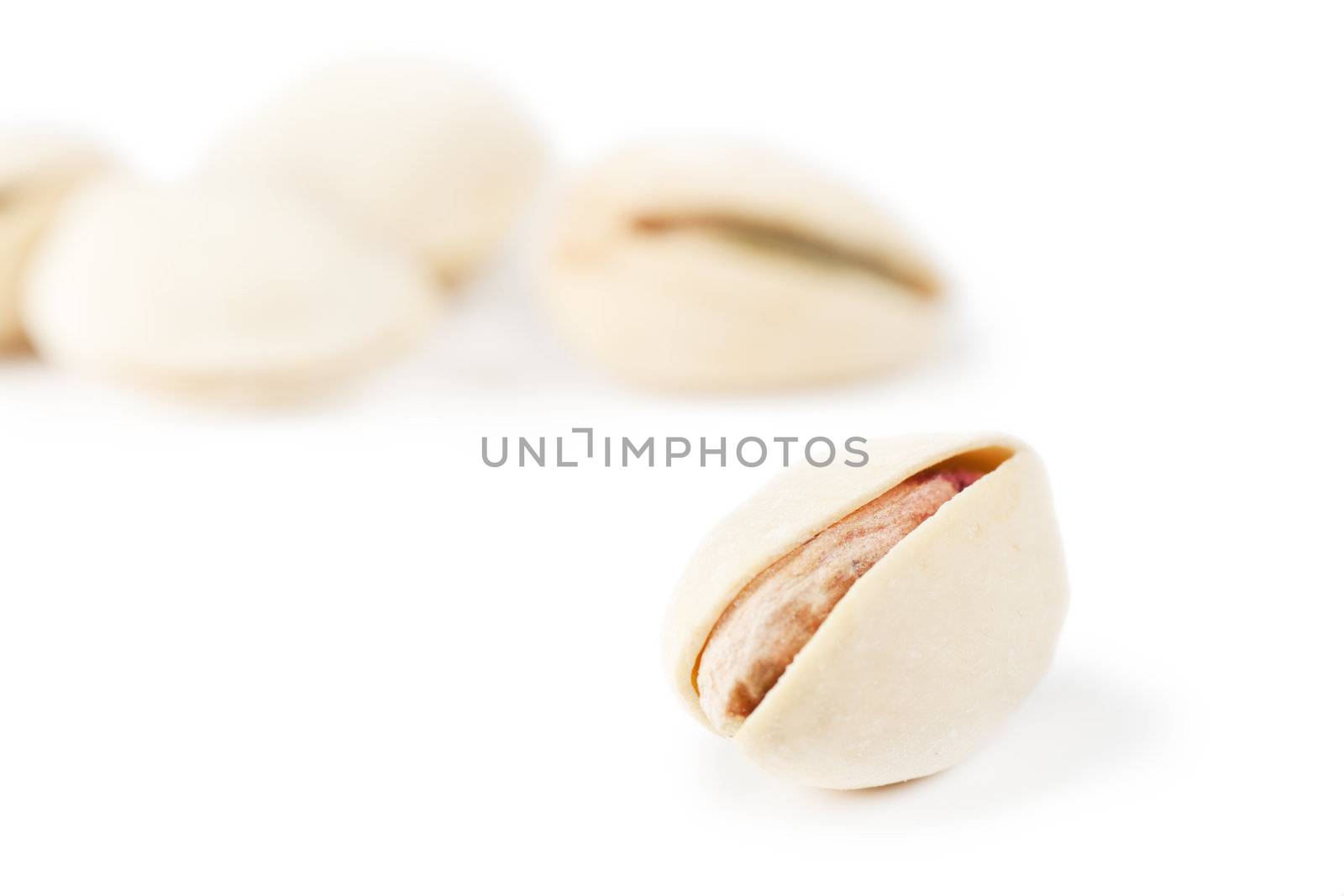 Macro view of pistachio over white background