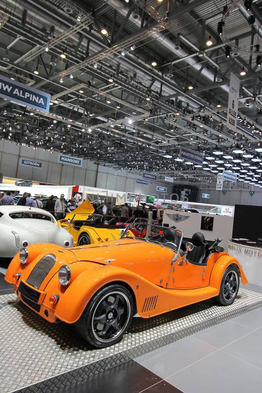 GENEVA - MARCH 16 : orange new Morgan Plus 8 on display at the 82st International Motor Show Palexpo -Geneva on March 16; 2012 in Geneva, Switzerland.