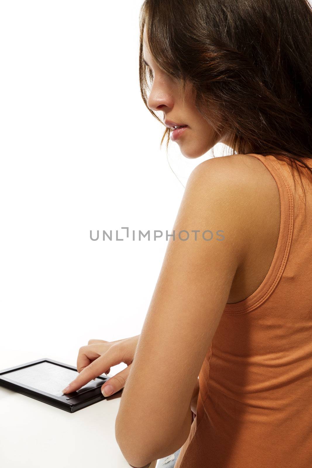 looking over the shoulder of a beautiful woman reading ebook on white background