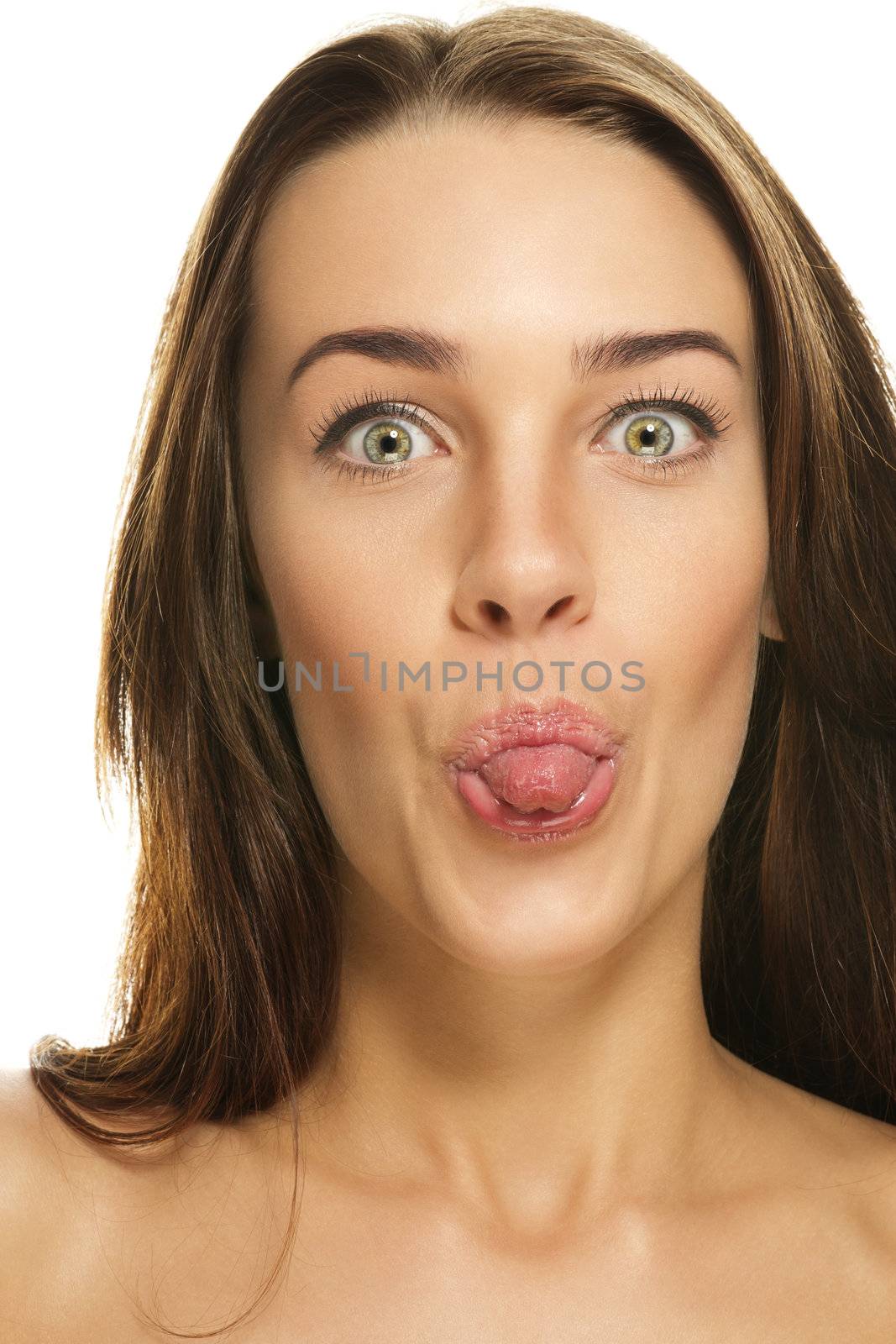 beautiful woman poking tongue out on white background