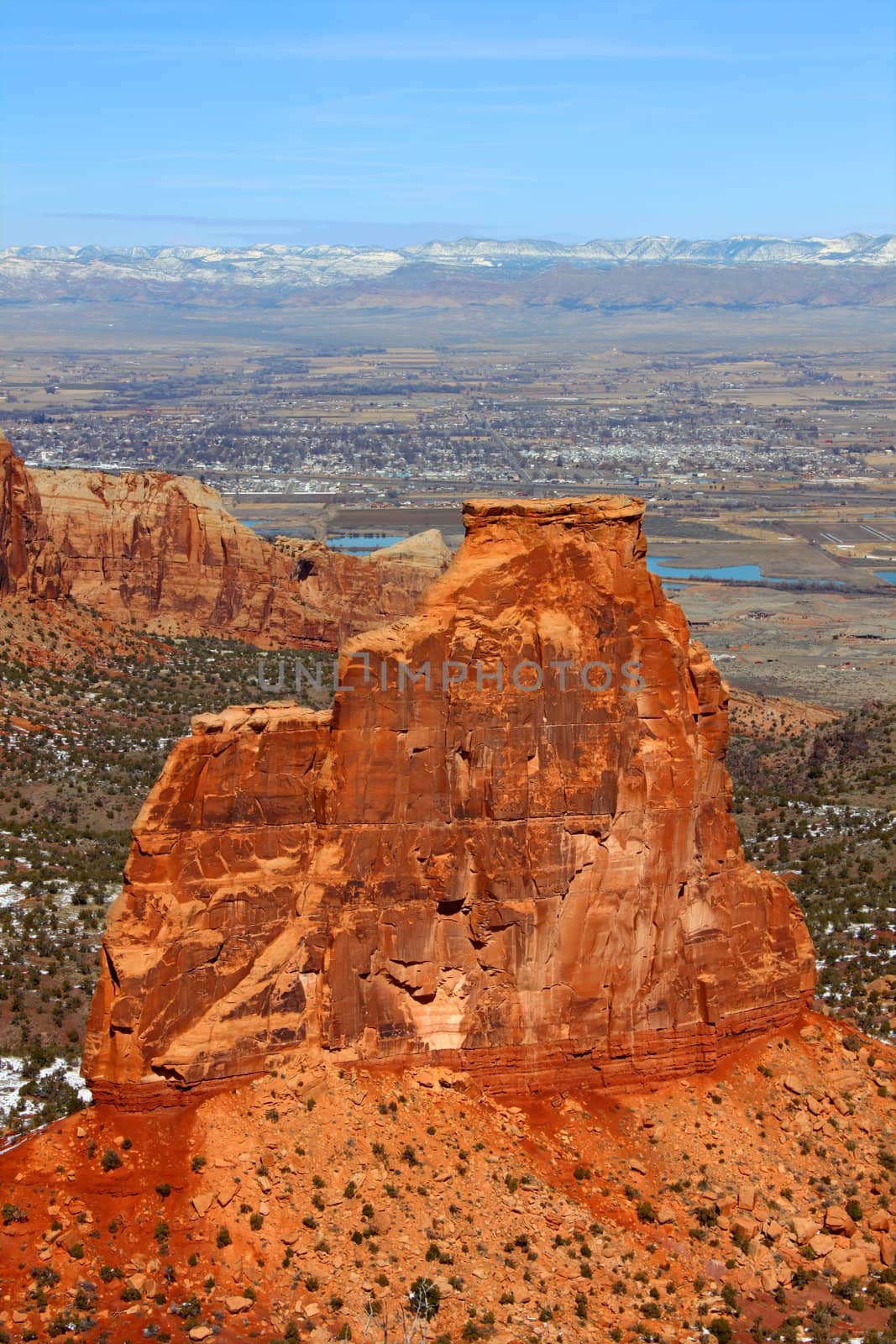 Rock monolith towering over the valley at Colorado national monument.