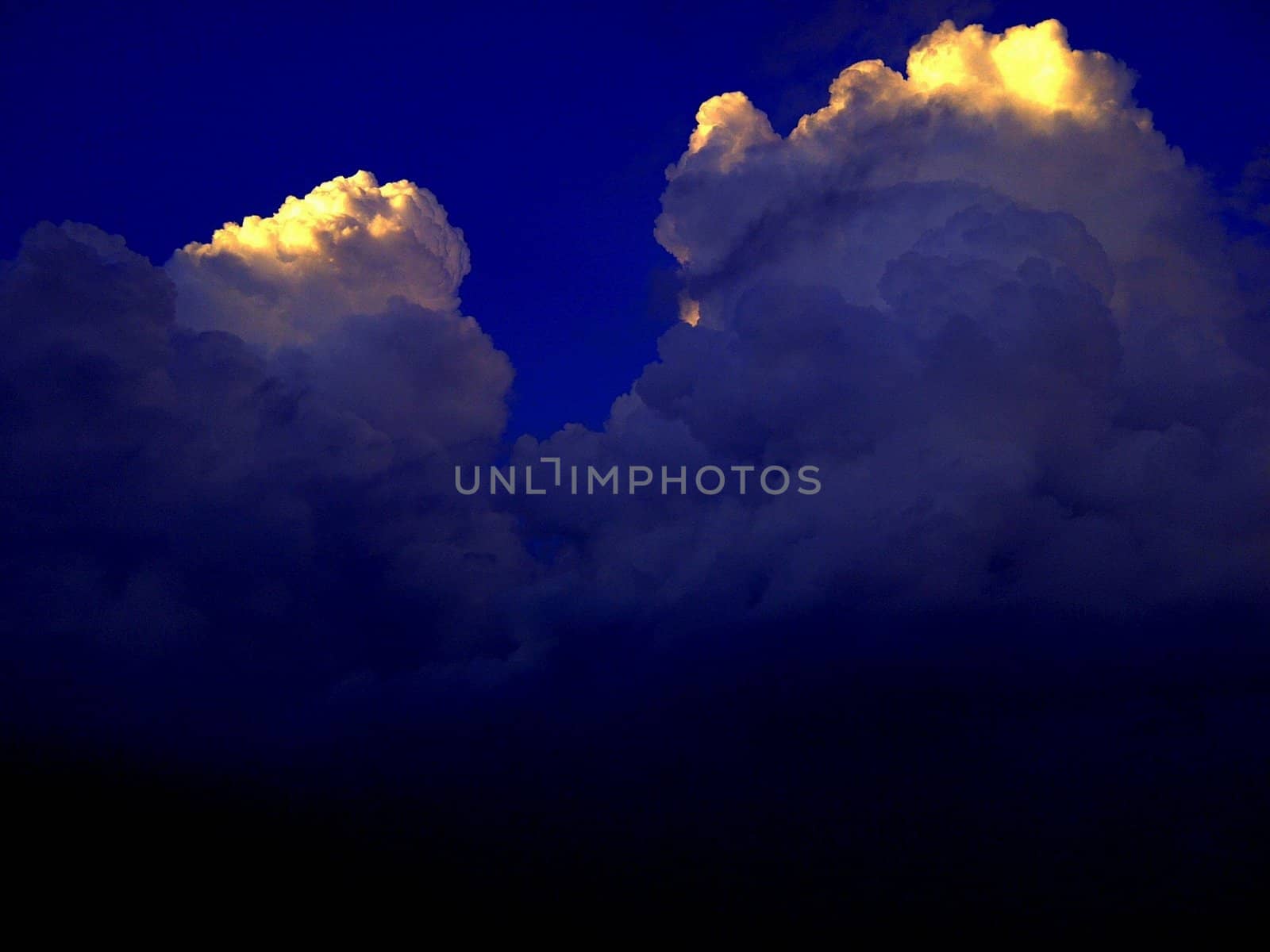 A storm front consisting of high Cumulonimbus storm clouds.