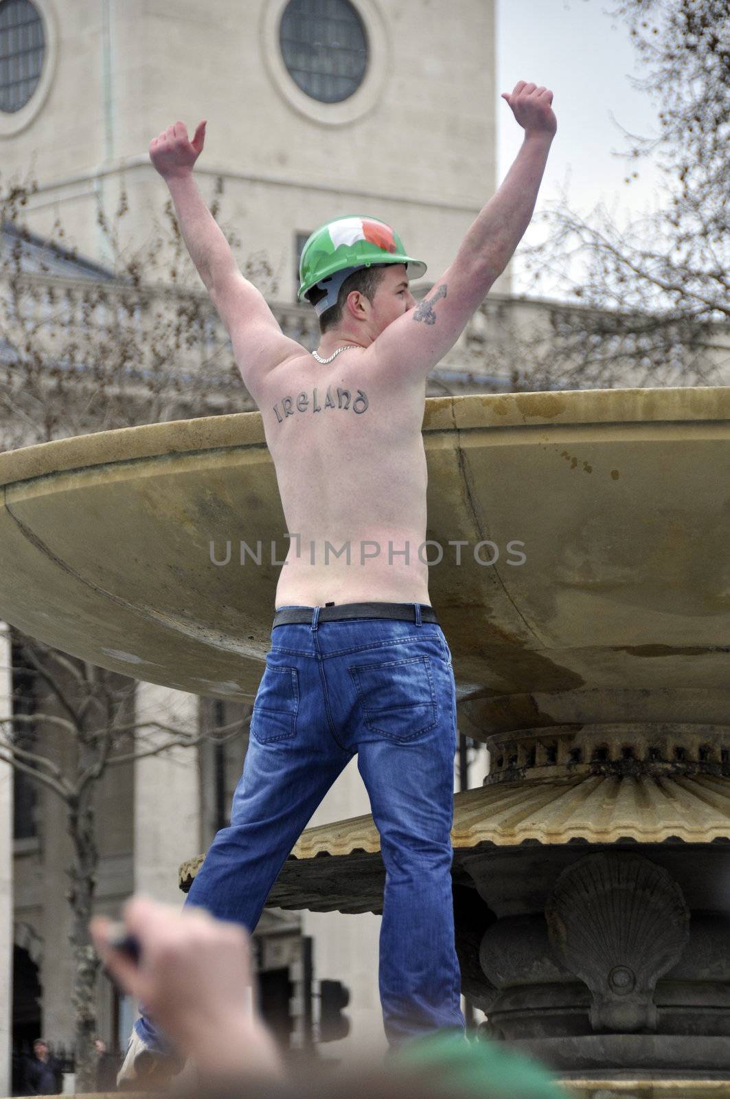 LONDON - MARCH 18: The crowd during the St Patrick's Day Parade and Festival at Trafalgar Square on March 18, 2012 in London, UK.