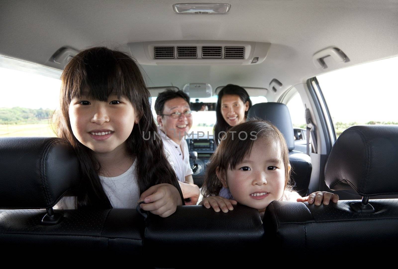 happy family in the car by tomwang