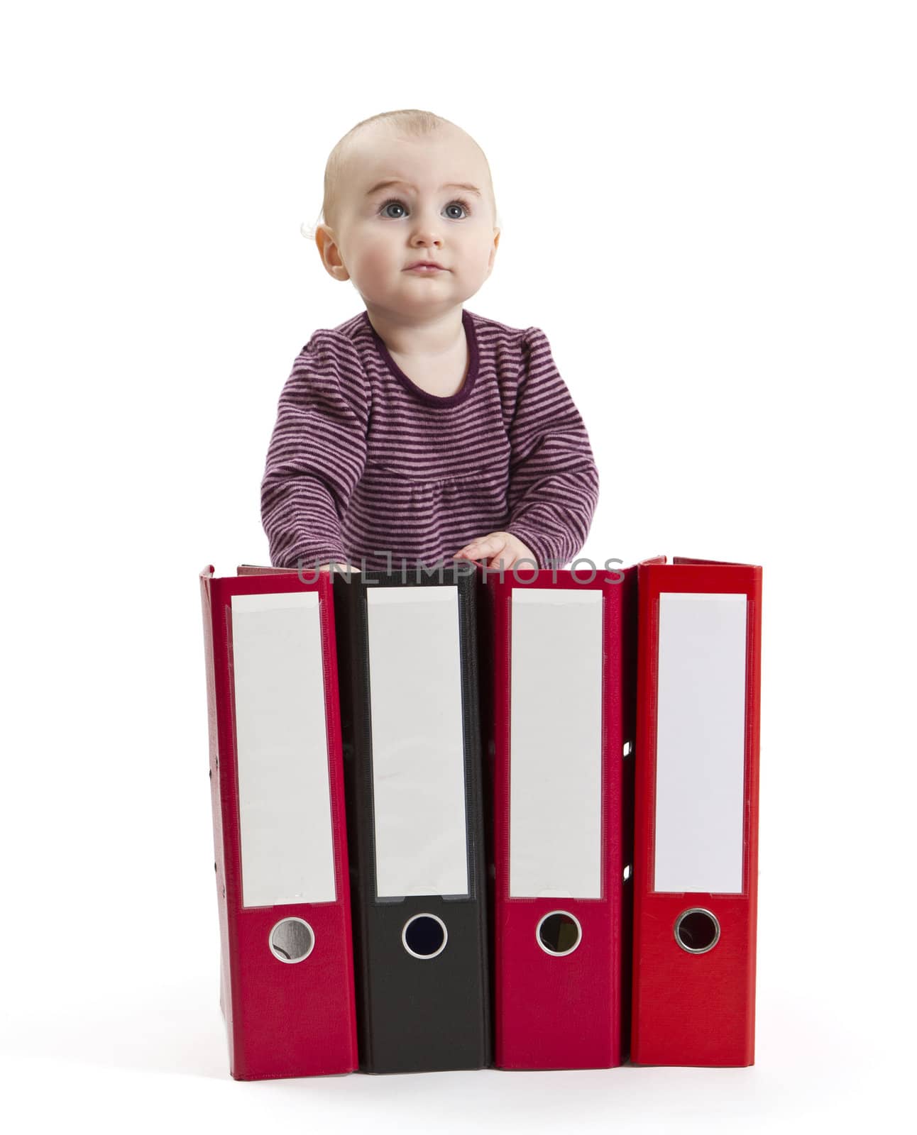 young child in light background with four ring files