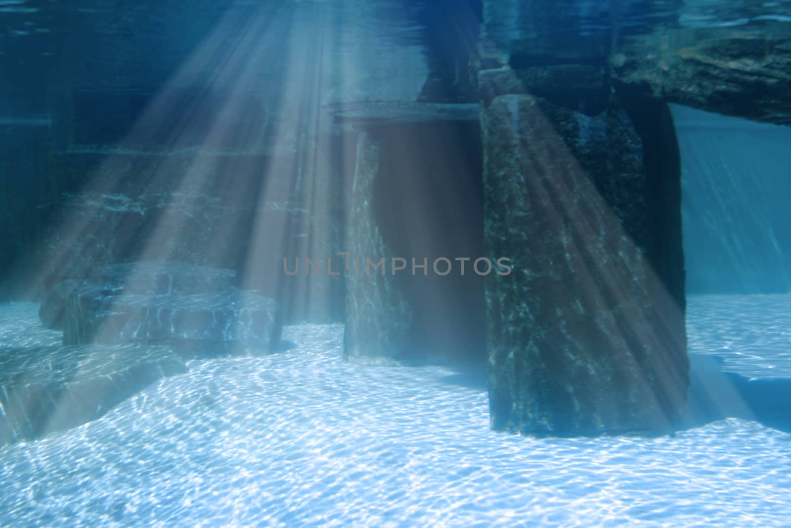 Underwater seascape with rocks and light shining