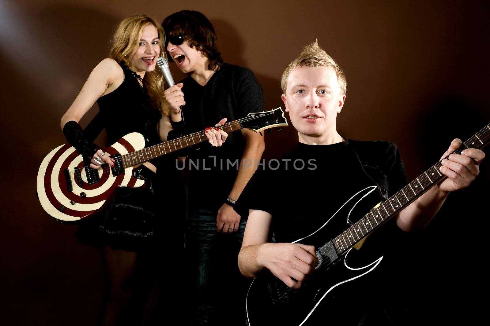 Funny rock band performance in photostudio