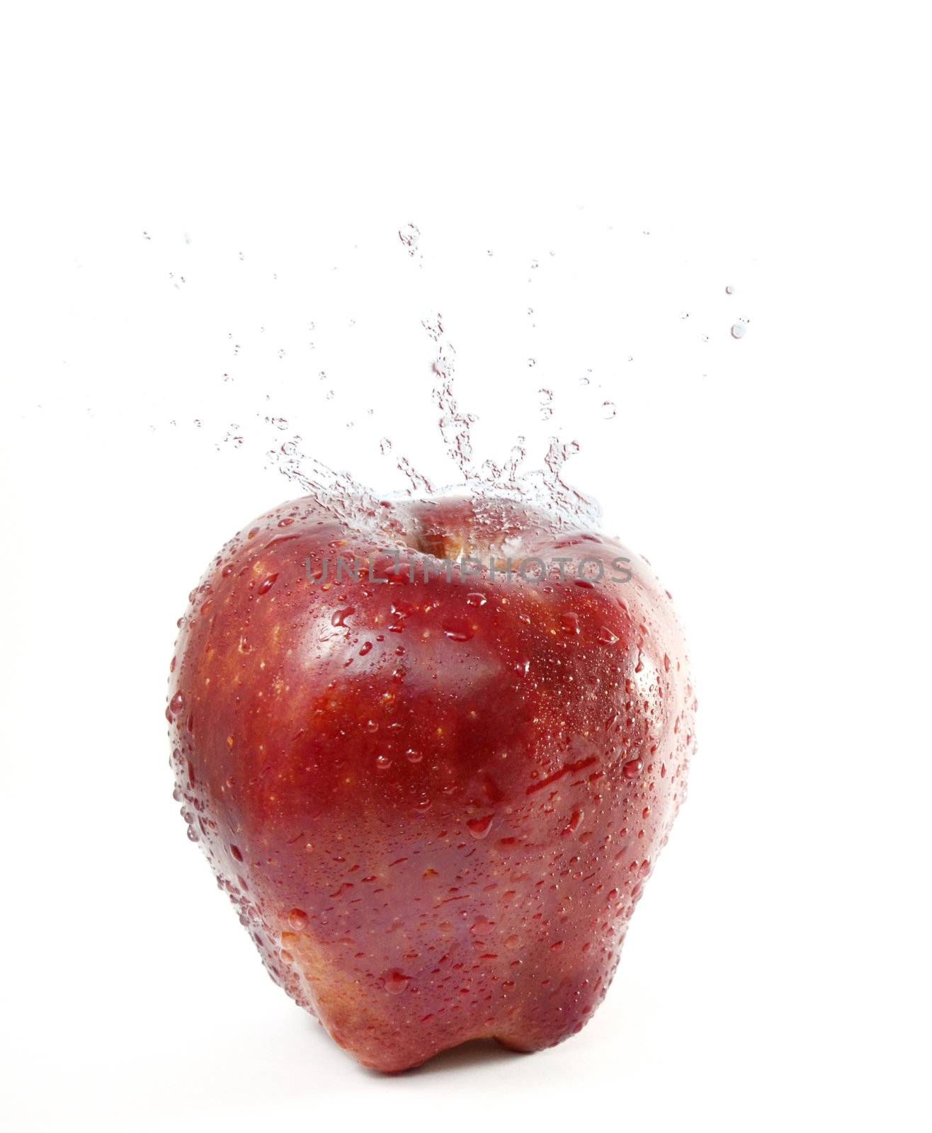 red apple  splashing water on  white  background