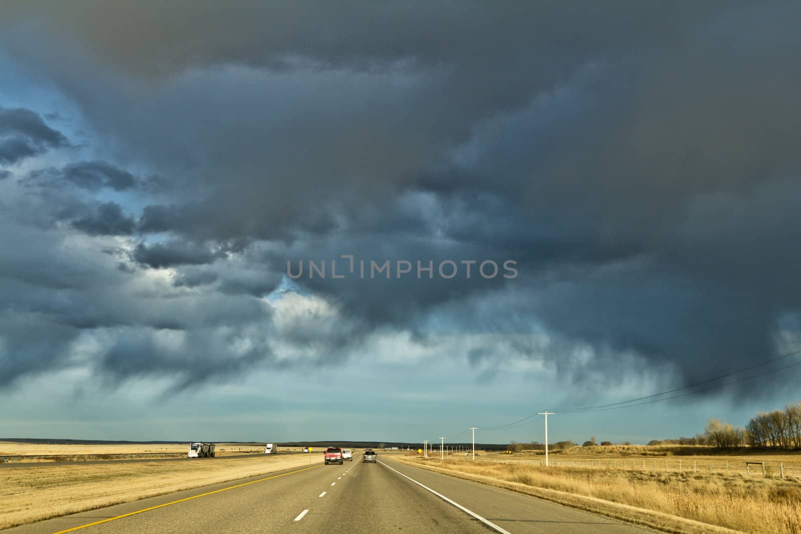 Dark clouds in the sky over highway one in Saskatchewan, Canada