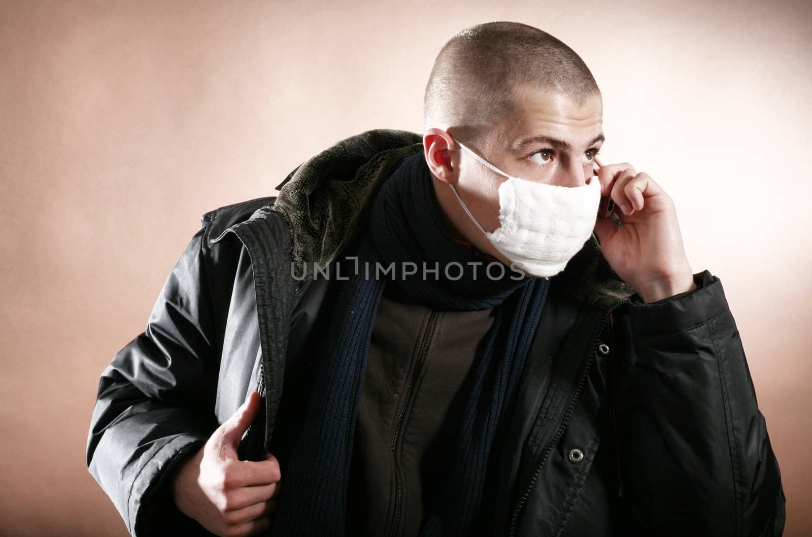 An image of a young man in medical mask