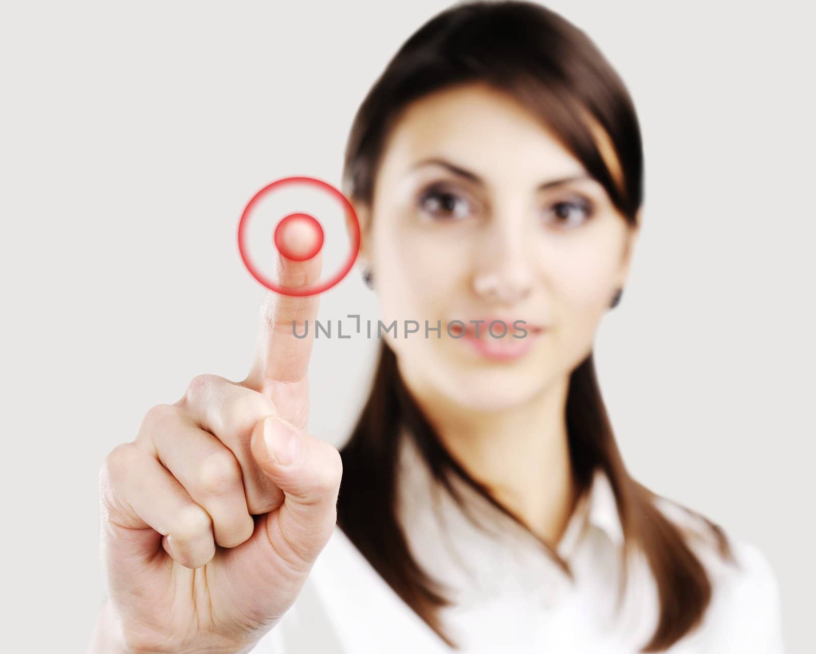 Young business woman pointing at something on screen