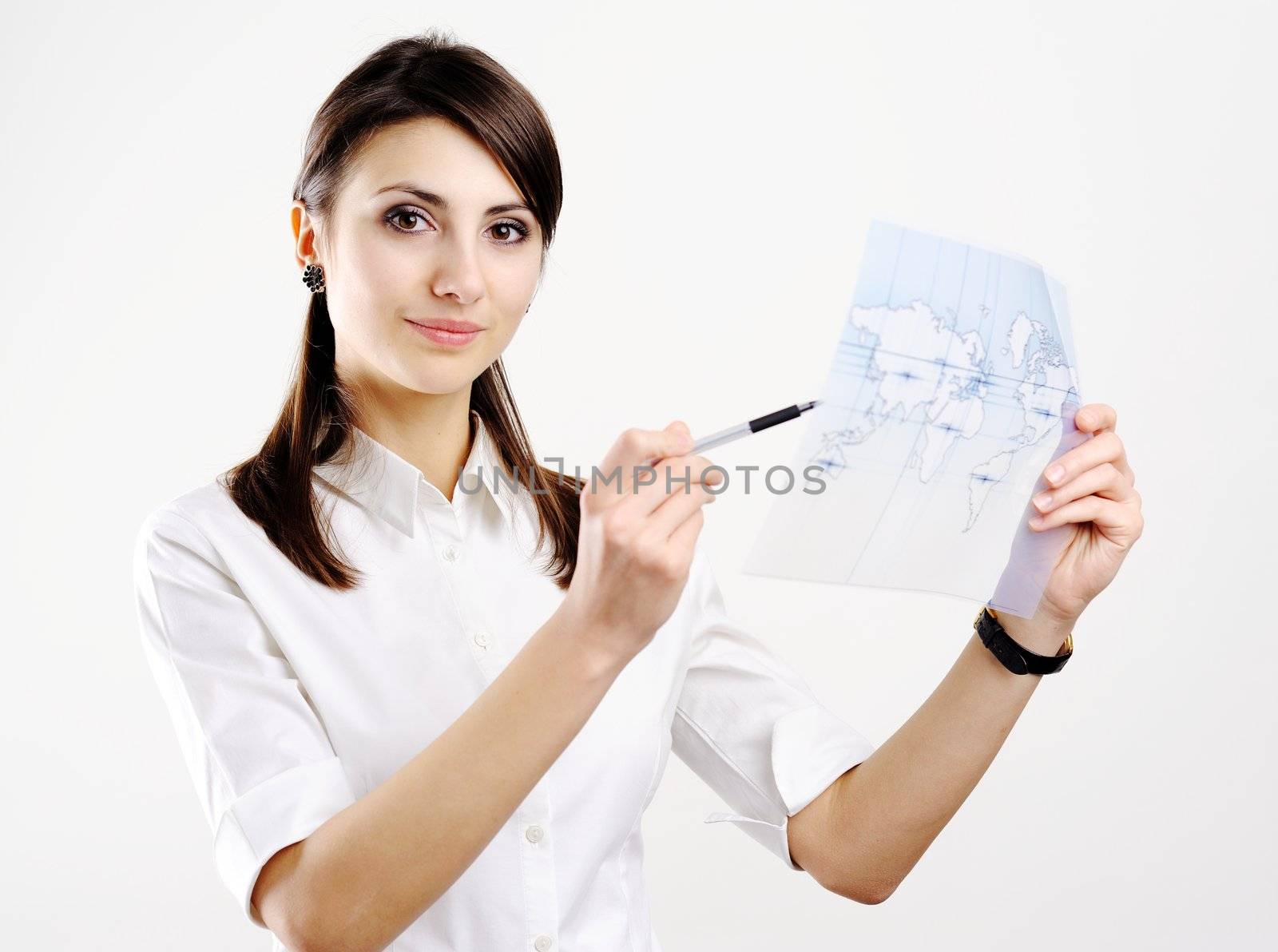 A girl holding a map of the world printed on a transparent material