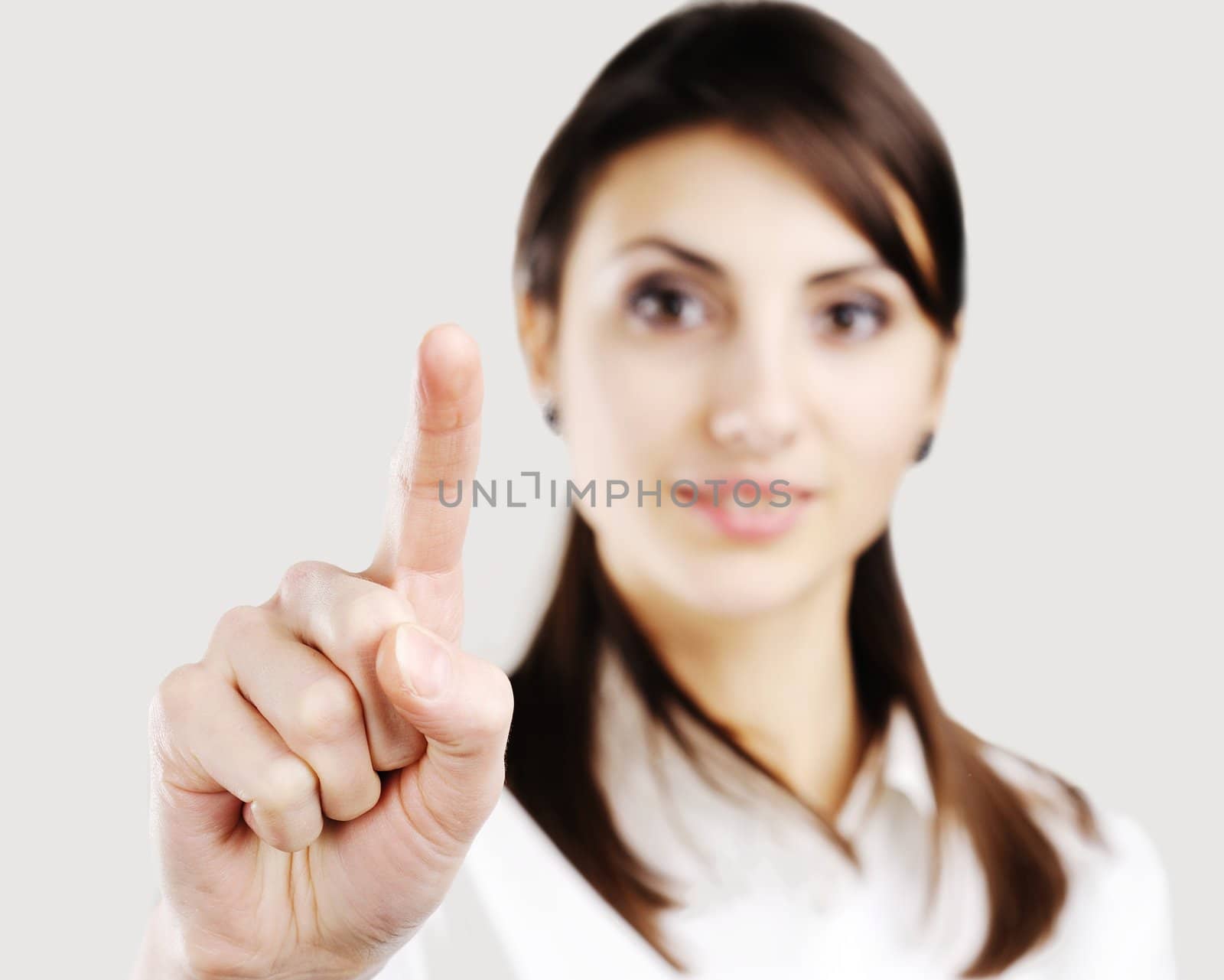 business woman pointing at something on screen