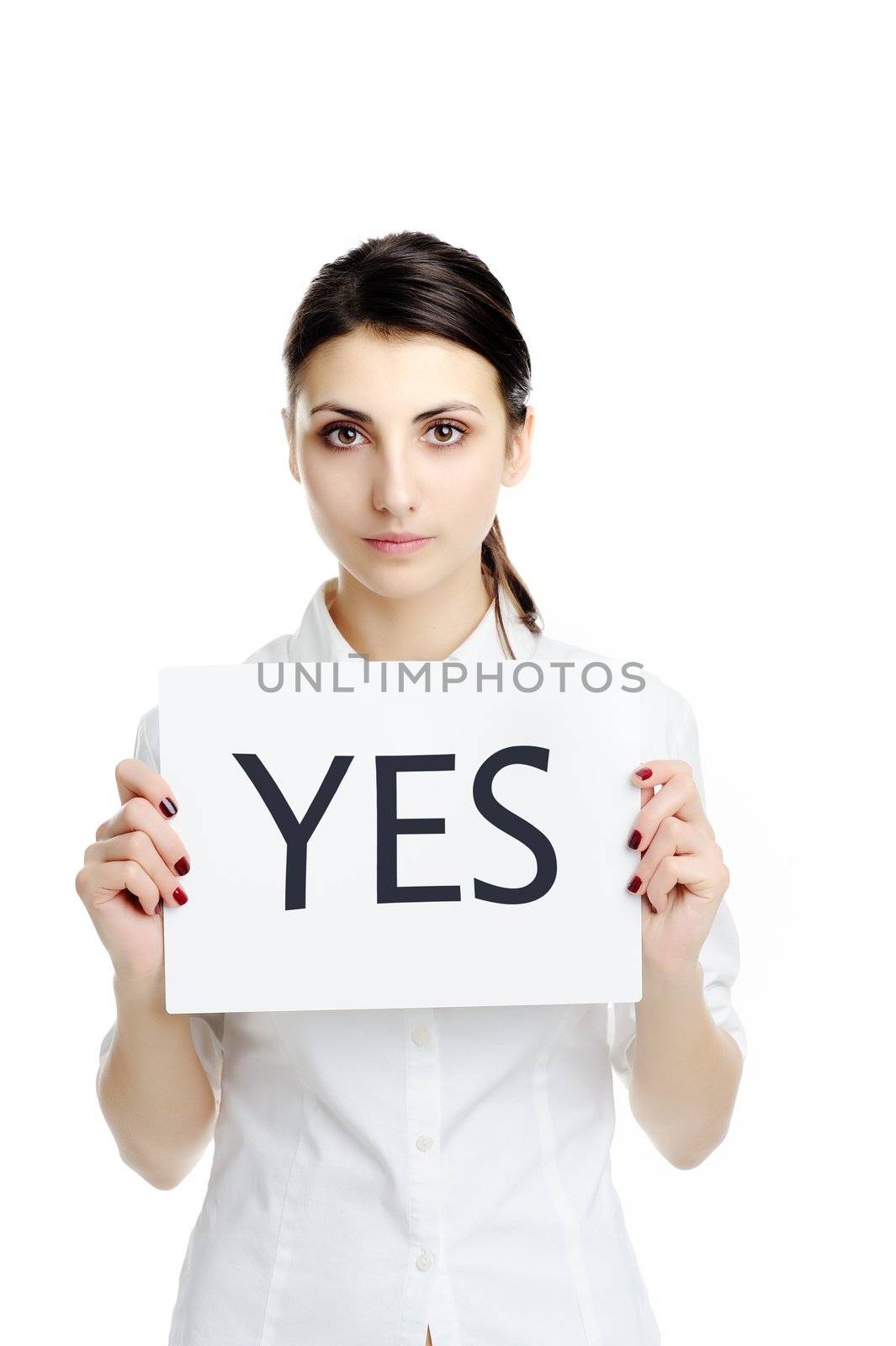 An image of young businesswoman holding sheet of papper with inscription YES