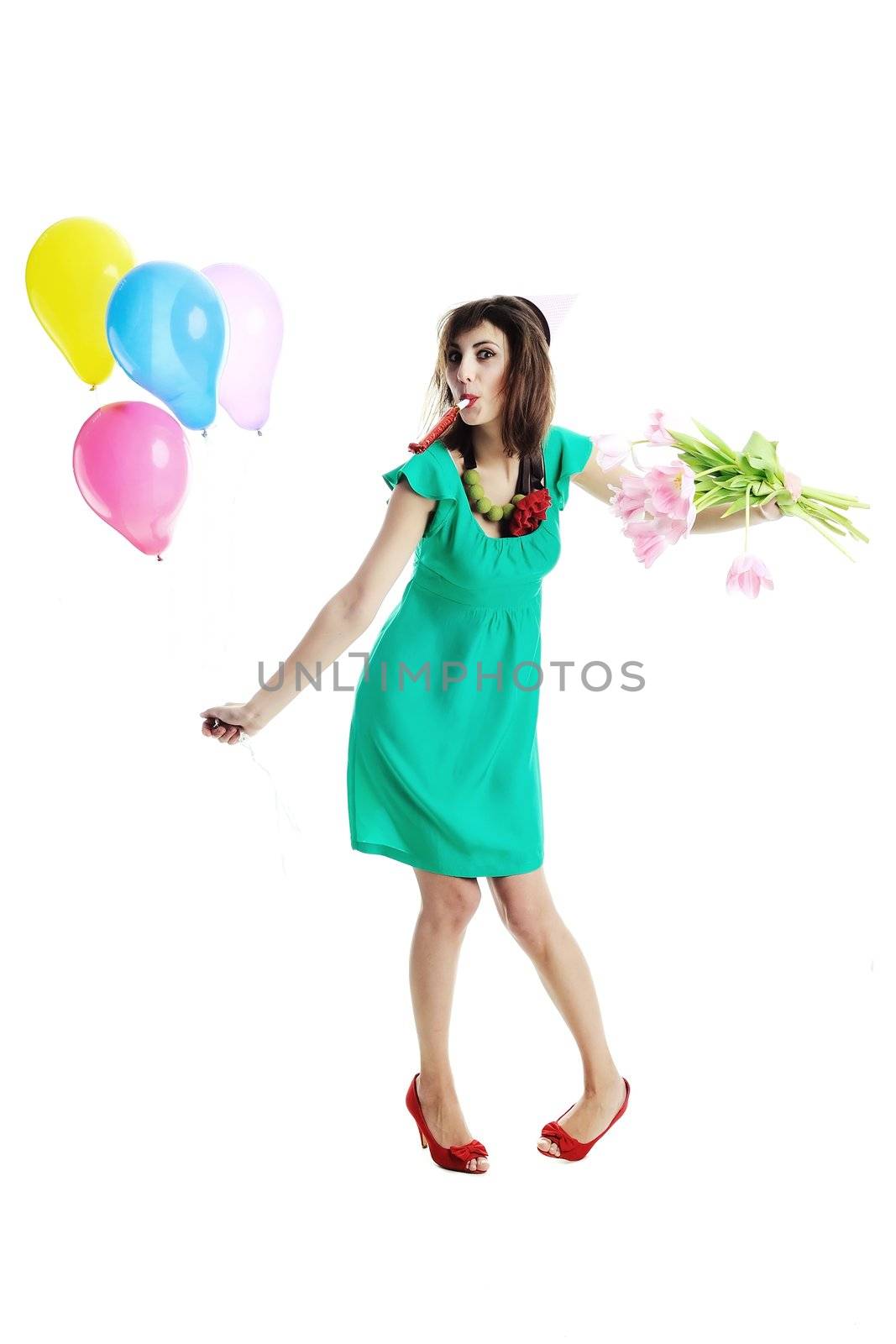 A young beautiful woman with tulips and balloons