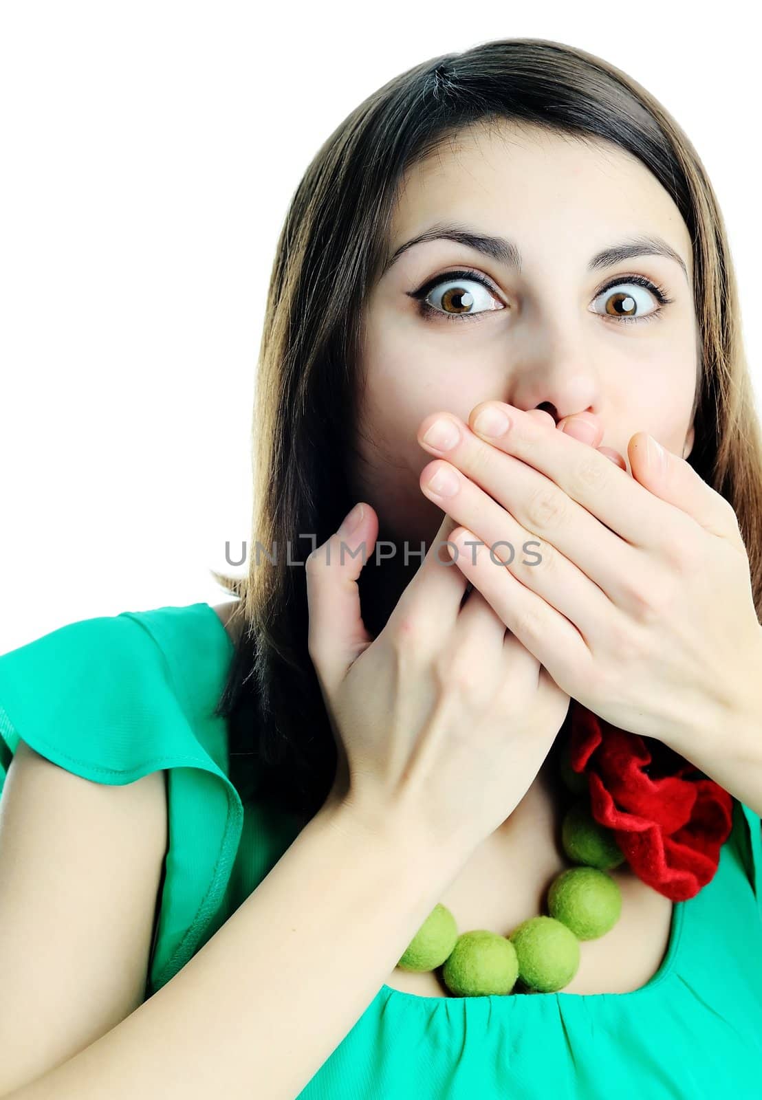 An image of a woman with her hands on her lips