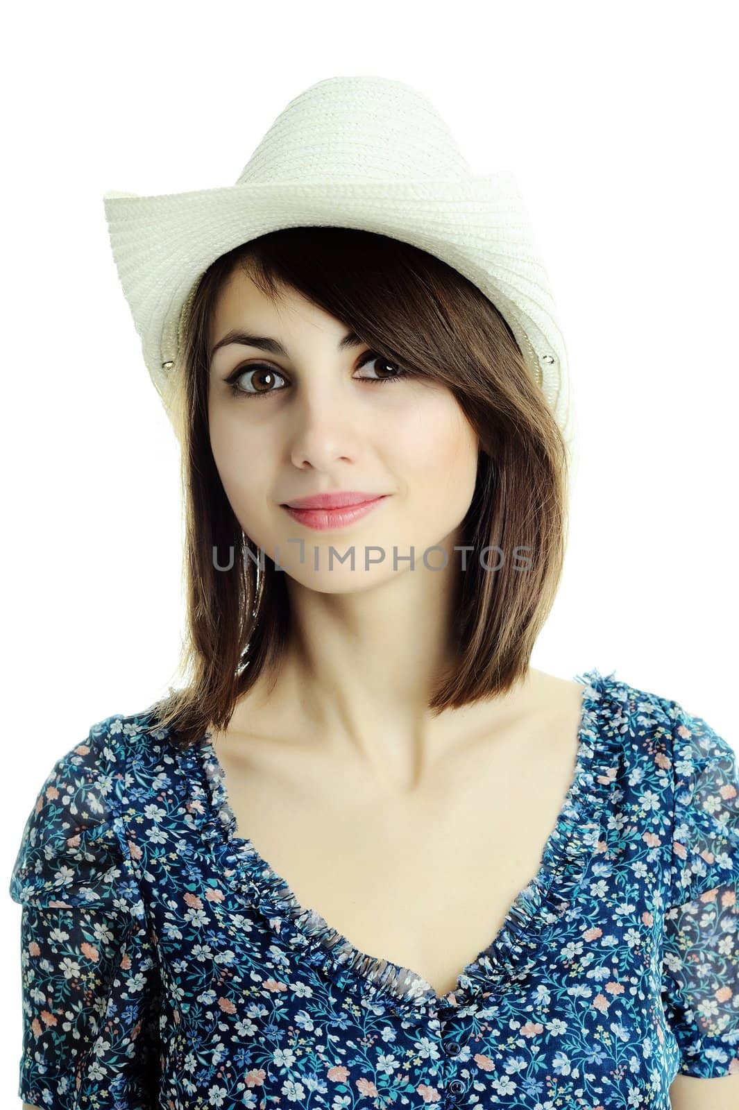 An image of a young beautiful woman in a hat