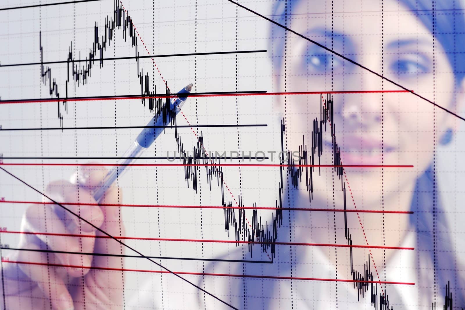 The businesswoman looks at the chart printed on a transparent material