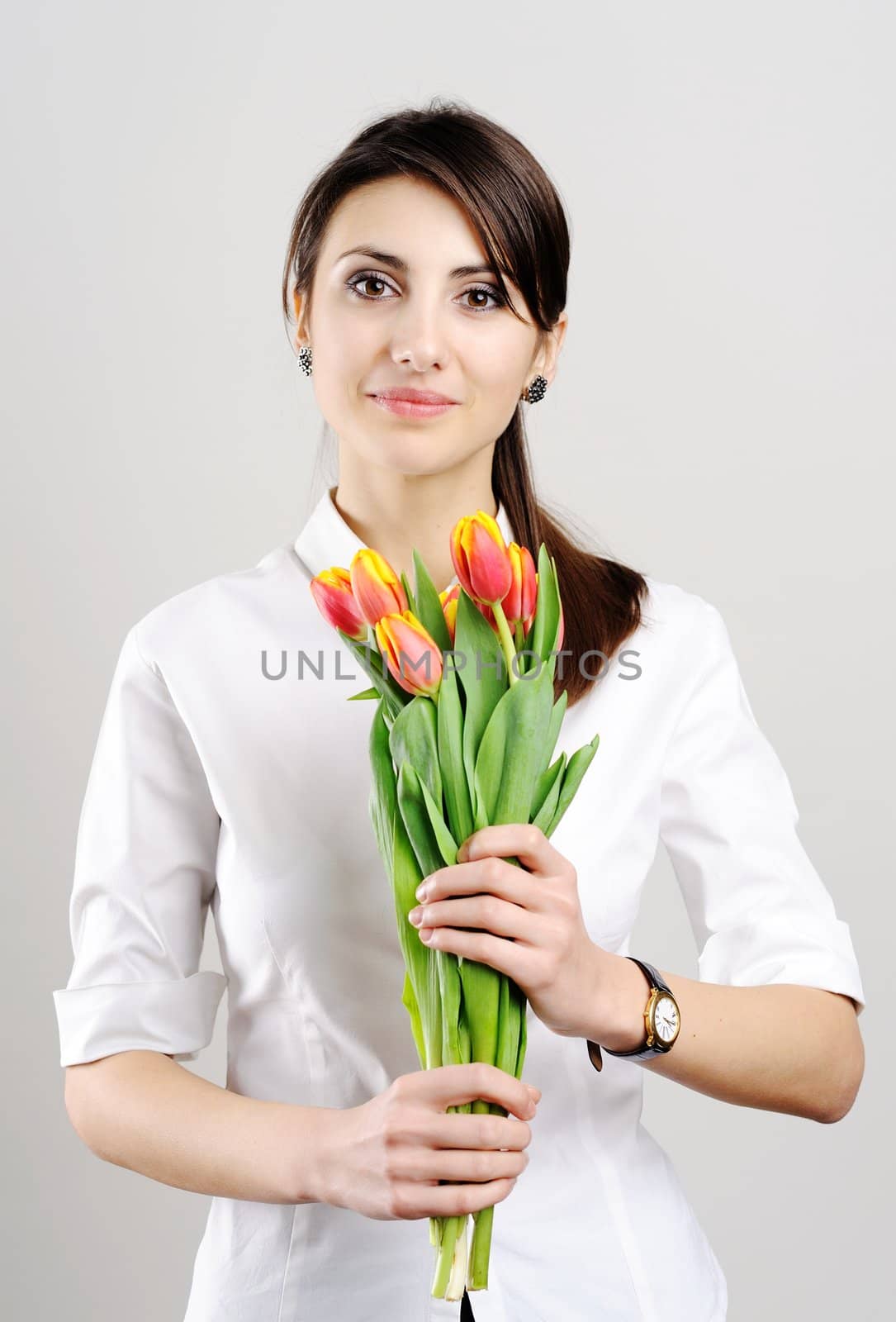 An image of a beautiful woman with tulips