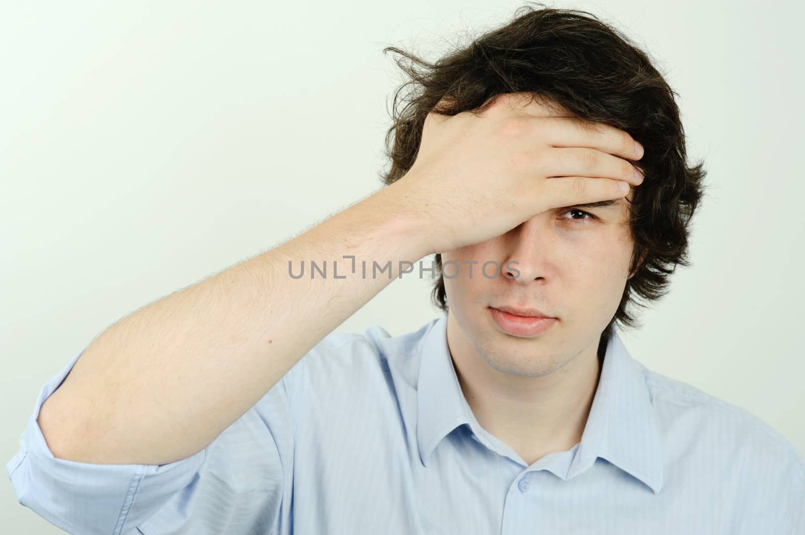 An image of a young man thinking  about something