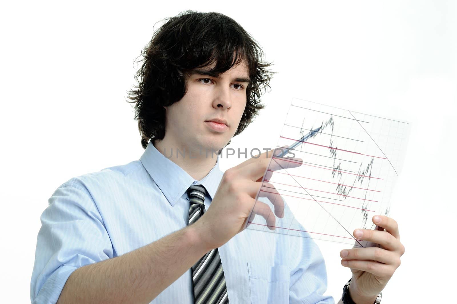 The businessman looks at the chart printed on a transparent material
