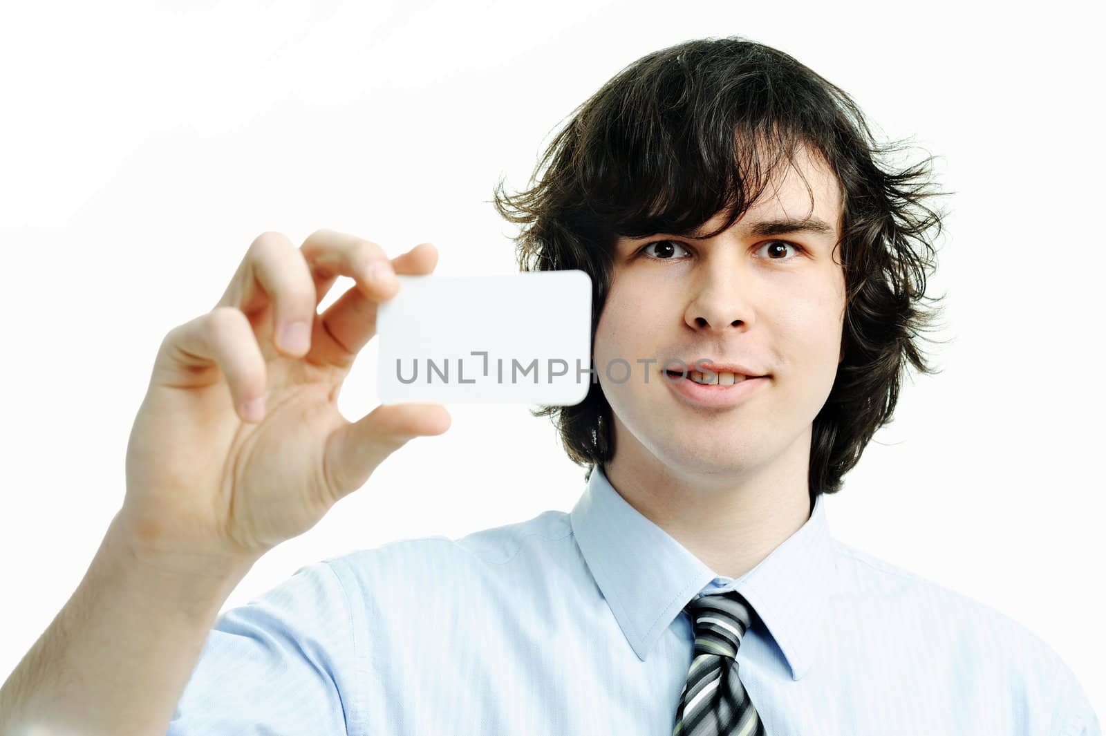 An image of yound businessman showing white card
