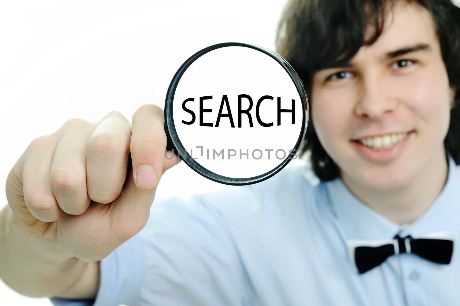 A young man with a magnifier with word ''search'' in it
